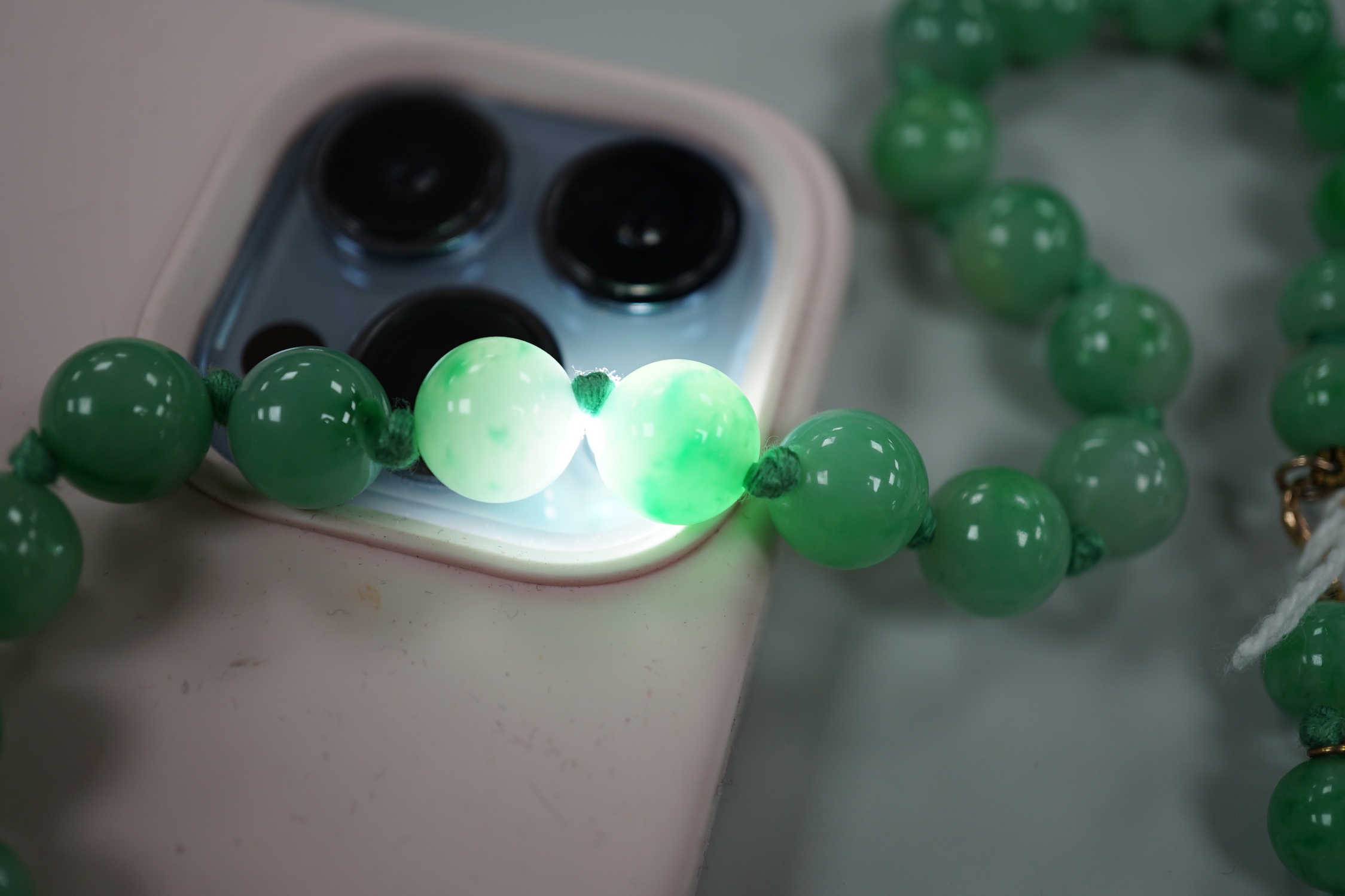 A single strand jade bead necklace, 58cm, gross weight 91 grams.